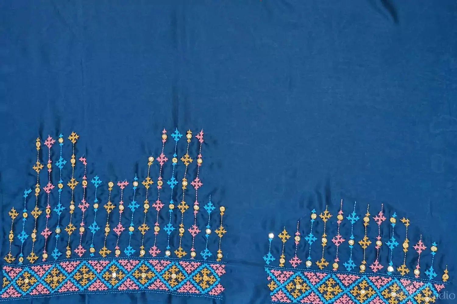Peacock blue semi silk material featuring mirro work kutch hand embroidery